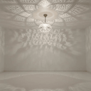Warm glow of brass mandala pendant light illuminating boho living room – Brass For Homes