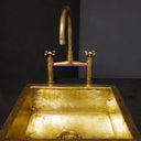 Unlacquered brass bridge kitchen faucet with sprayer and cross handles – full set lifestyle view